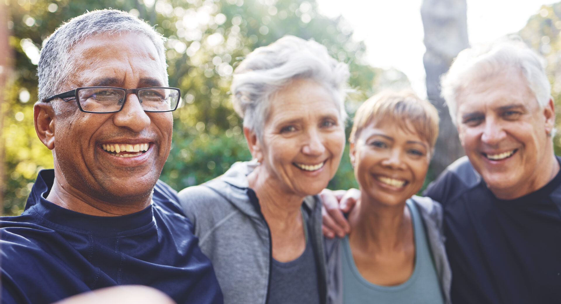 nature-selfie-and-senior-friends-on-a-hike-for-wellness-exercise-and-health-in-the-woods-happy-smile-and-portrait-of-a-group-of-elderly-people-in-retirement-in-forest-trekking-together-in-summer-Miami elderly community